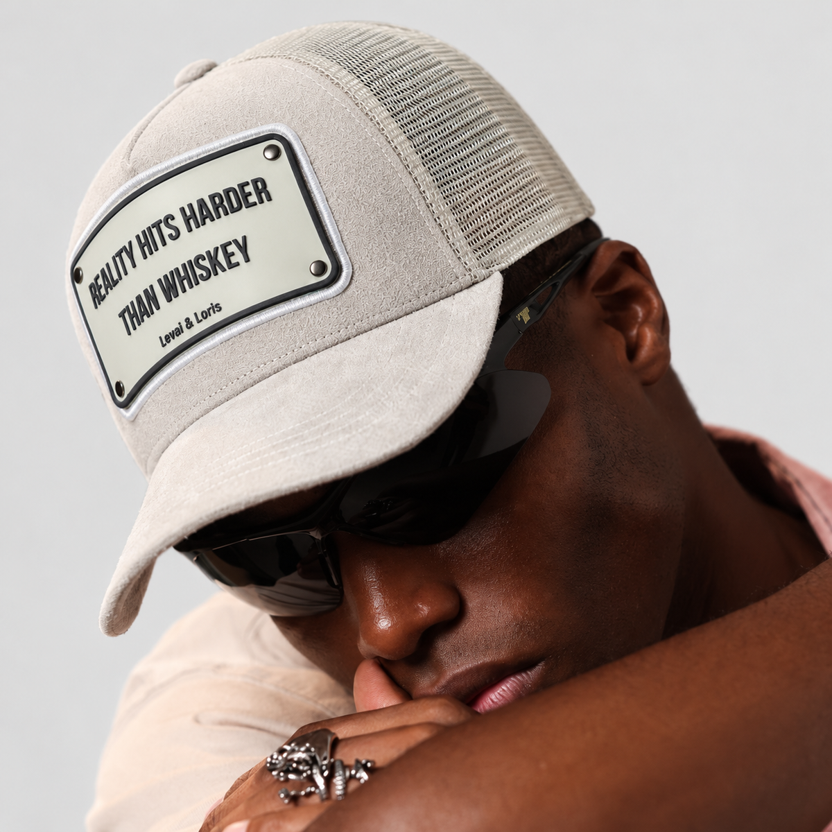 Reality Hits harder whisky Trucker cap